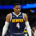 Jan 10, 2025; Denver, Colorado, USA; Denver Nuggets guard Russell Westbrook (4) during the second quarter against the Brooklyn Nets at Ball Arena. Mandatory Credit: Ron Chenoy-Imagn Images