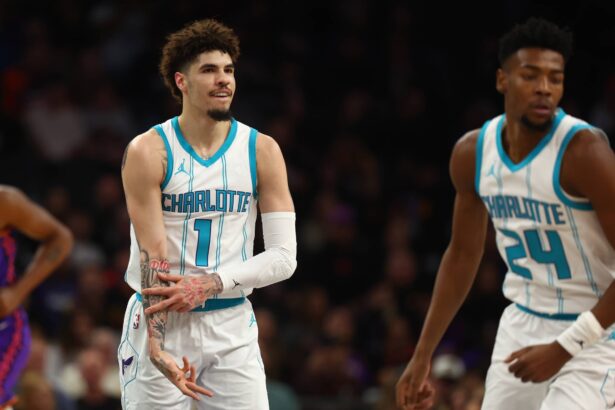 Jan 12, 2025; Phoenix, Arizona, USA; Charlotte Hornets guard LaMelo Ball (1) reacts after a basket against the Phoenix Suns during the first half at Footprint Center. Mandatory Credit: Mark J. Rebilas-Imagn Images