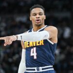 Jan 25, 2025; Minneapolis, Minnesota, USA; Denver Nuggets guard Russell Westbrook (4) reacts during the third quarter against the Minnesota Timberwolves at Target Center. Mandatory Credit: Jeffrey Becker-Imagn Images