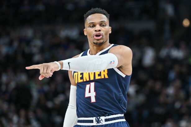 Jan 25, 2025; Minneapolis, Minnesota, USA; Denver Nuggets guard Russell Westbrook (4) reacts during the third quarter against the Minnesota Timberwolves at Target Center. Mandatory Credit: Jeffrey Becker-Imagn Images