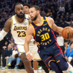 Jan 25, 2025; San Francisco, California, USA; Golden State Warriors guard Stephen Curry (30) dribbles against Los Angeles Lakers forward LeBron James (23) during the third quarter at Chase Center. Mandatory Credit: Darren Yamashita-Imagn Images