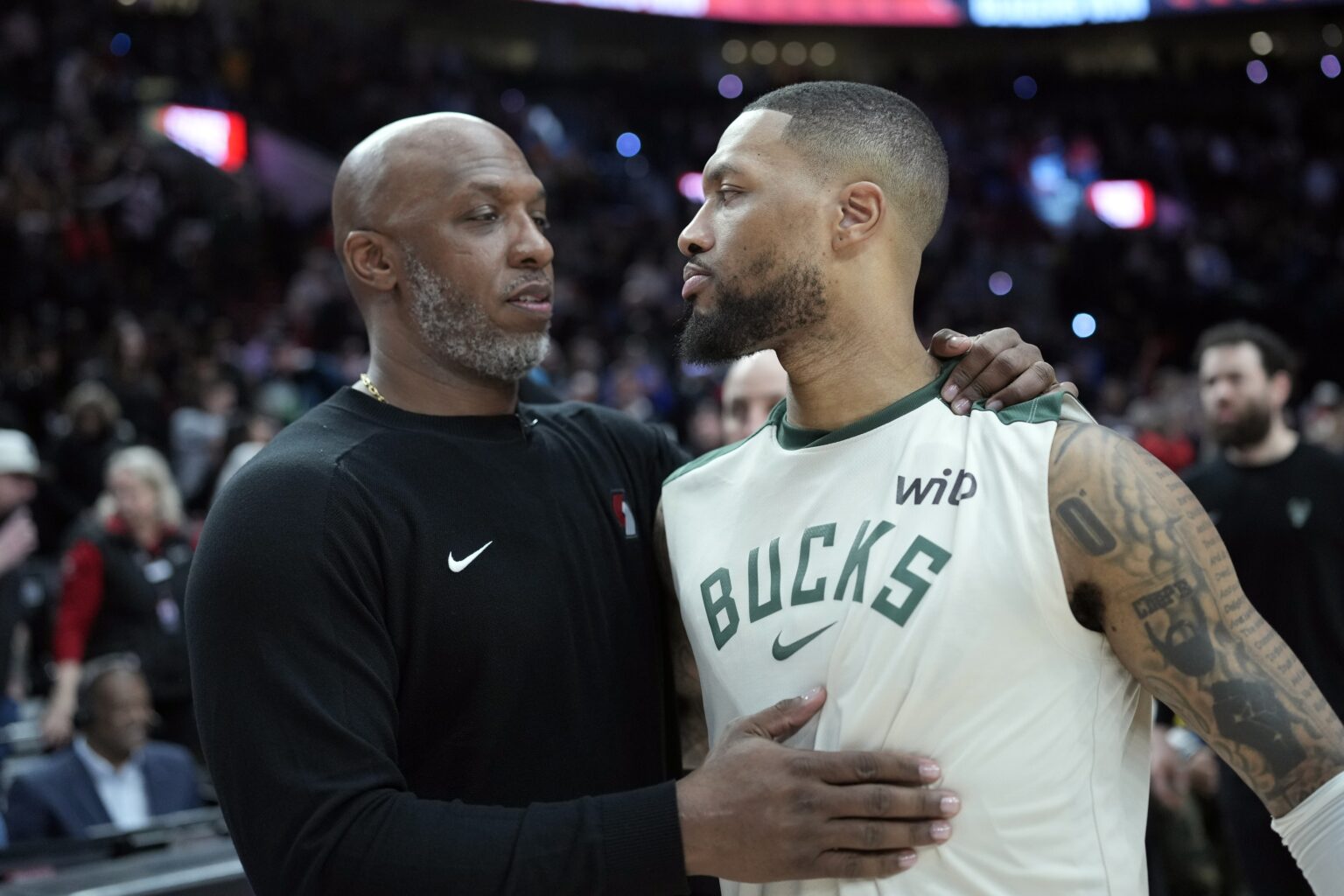 Jan 28, 2025; Portland, Oregon, USA; Portland Trail Blazers head coach Chauncey Billups embraces Milwaukee Bucks point guard Damian Lillard (0, right) after a game at Moda Center. Mandatory Credit: Soobum Im-Imagn Images