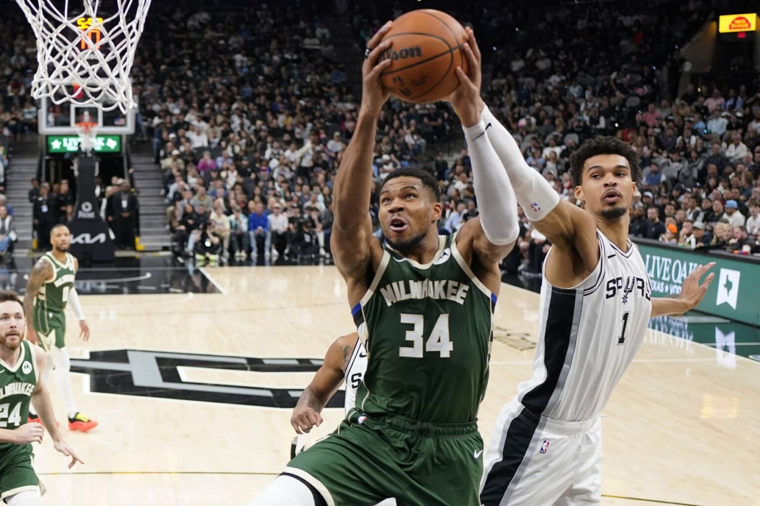 Jan 31, 2025; San Antonio, Texas, USA; Milwaukee Bucks forward Giannis Antetokounmpo (34) drives to the basket while defended by San Antonio Spurs center Victor Wembanyama (1) during the first half at Frost Bank Center. Mandatory Credit: Scott Wachter-Imagn Images