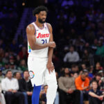 Feb 11, 2025; Philadelphia, Pennsylvania, USA; Philadelphia 76ers center Joel Embiid (21) holds his arm after falling against the Toronto Raptors in the second quarter at Wells Fargo Center. Mandatory Credit: Kyle Ross-Imagn Images