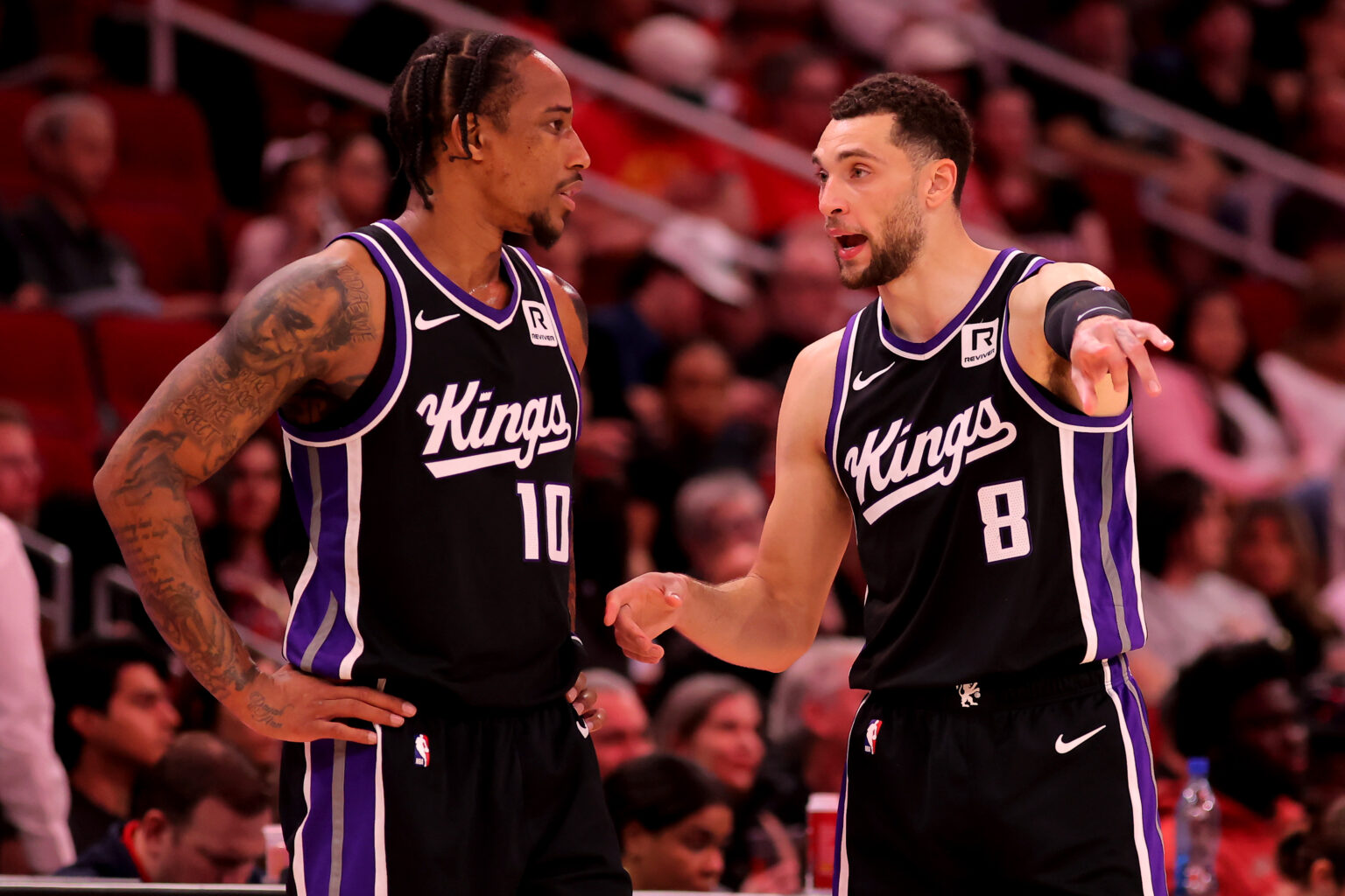 Mar 1, 2025; Houston, Texas, USA; Sacramento Kings forward DeMar DeRozan (10) talks with guard Zach LaVine (8) during a timeout against the Houston Rockets during the third quarter at Toyota Center. Mandatory Credit: Erik Williams-Imagn Images