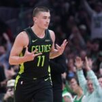 Mar 6, 2025; Boston, Massachusetts, USA; Boston Celtics guard Payton Pritchard (11) reacts after his three point basket against the Philadelphia 76ers in the second quarter at TD Garden. Mandatory Credit: David Butler II-Imagn Images