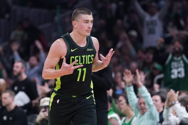 Mar 6, 2025; Boston, Massachusetts, USA; Boston Celtics guard Payton Pritchard (11) reacts after his three point basket against the Philadelphia 76ers in the second quarter at TD Garden. Mandatory Credit: David Butler II-Imagn Images