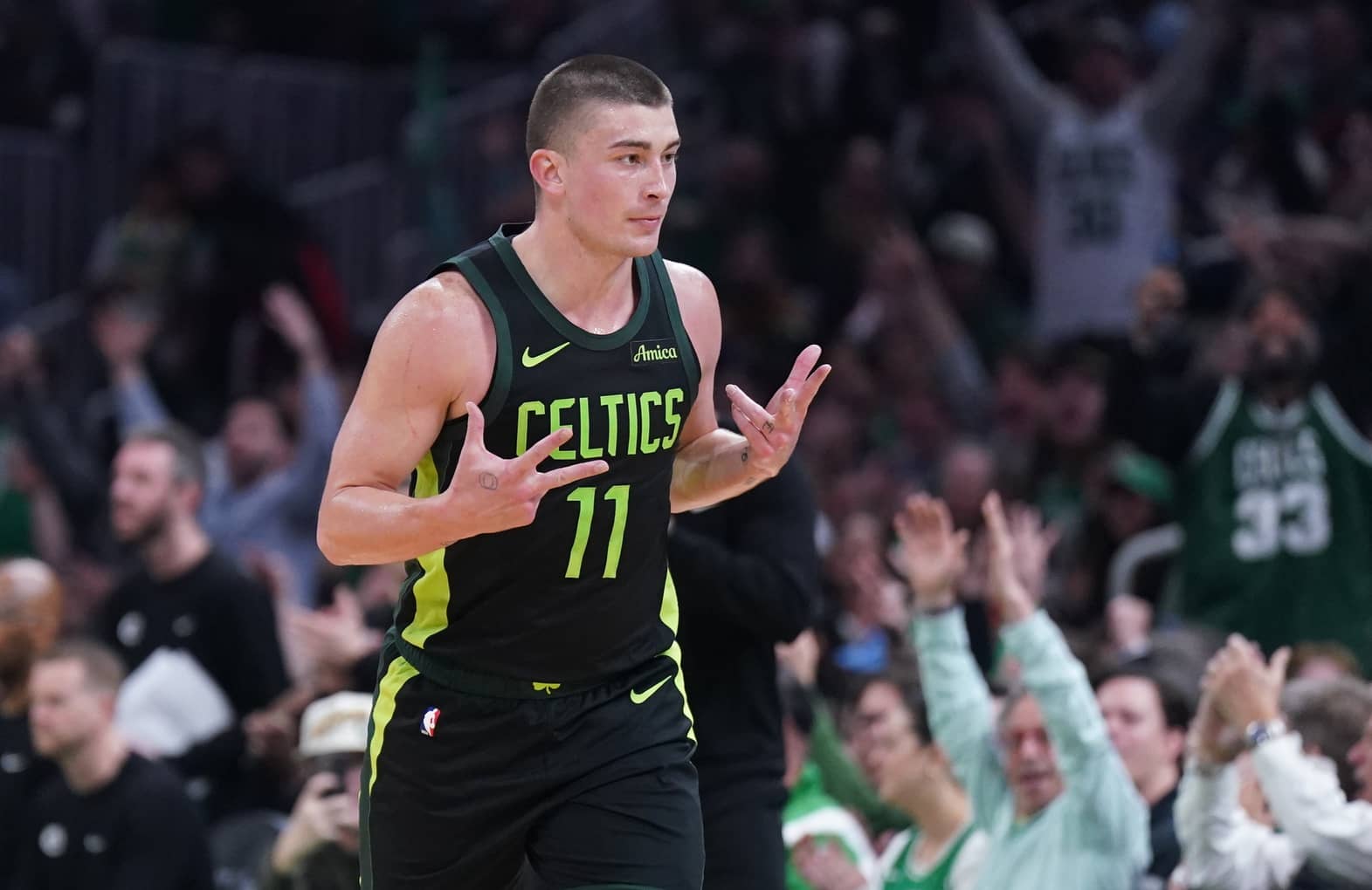 Mar 6, 2025; Boston, Massachusetts, USA; Boston Celtics guard Payton Pritchard (11) reacts after his three point basket against the Philadelphia 76ers in the second quarter at TD Garden. Mandatory Credit: David Butler II-Imagn Images