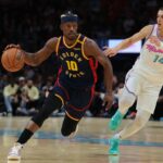 Mar 25, 2025; Miami, Florida, USA; Golden State Warriors forward Jimmy Butler III (10) drives to the basket past Miami Heat guard Tyler Herro (14) during the first quarter at Kaseya Center. Mandatory Credit: Sam Navarro-Imagn Images