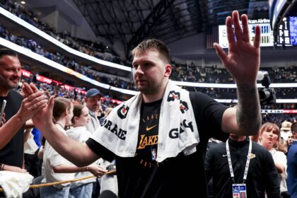 Apr 9, 2025; Dallas, Texas, USA; Los Angeles Lakers guard Luka Doncic (77) waves to fans after the game against the Dallas Mavericks at American Airlines Center. Mandatory Credit: Kevin Jairaj-Imagn Images