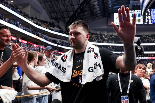 Apr 9, 2025; Dallas, Texas, USA; Los Angeles Lakers guard Luka Doncic (77) waves to fans after the game against the Dallas Mavericks at American Airlines Center. Mandatory Credit: Kevin Jairaj-Imagn Images