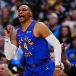 Apr 19, 2025; Denver, Colorado, USA; Denver Nuggets guard Russell Westbrook (4) reacts to his three point basket in the fourth quarter against the LA Clippers at Ball Arena. Mandatory Credit: Ron Chenoy-Imagn Images