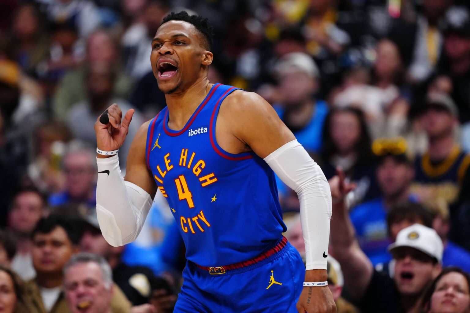 Apr 19, 2025; Denver, Colorado, USA; Denver Nuggets guard Russell Westbrook (4) reacts to his three point basket in the fourth quarter against the LA Clippers at Ball Arena. Mandatory Credit: Ron Chenoy-Imagn Images