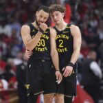 May 4, 2025; Houston, Texas, USA; Golden State Warriors guard Stephen Curry (30) and guard Brandin Podziemski (2) talk during a timeout during game seven of first round for the 2025 NBA Playoffs against the Houston Rockets at Toyota Center. Mandatory Credit: Troy Taormina-Imagn Images