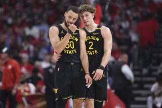May 4, 2025; Houston, Texas, USA; Golden State Warriors guard Stephen Curry (30) and guard Brandin Podziemski (2) talk during a timeout during game seven of first round for the 2025 NBA Playoffs against the Houston Rockets at Toyota Center. Mandatory Credit: Troy Taormina-Imagn Images