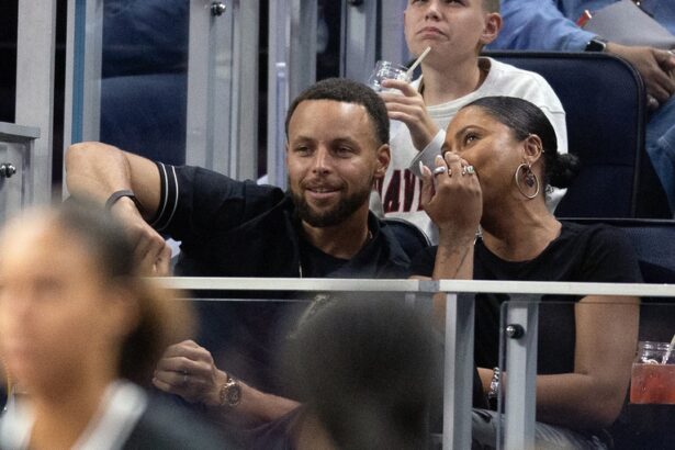 Aug 9, 2025; San Francisco, California, USA; Golden State Warriors star Stephen Curry and his wife Ayesha take in a Golden State Valkyries game against the Los Angeles Sparks at Chase Center. Mandatory Credit: D. Ross Cameron-Imagn Images