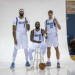 Sep 29, 2025; Dallas, TX, USA; Dallas Mavericks forward Anthony Davis (3) and guard Kyrie Irving (11) and forward Cooper Flagg (32) pose for a photo during the Mavericks 2025 media day at the American Airlines Center. Mandatory Credit: Jerome Miron-Imagn Images