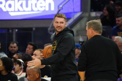 Oct 5, 2025; San Francisco, California, USA; Los Angeles Lakers forward/guard Luka Doncic (77) watches the action from the bench during a game against the Golden State Warriors in the second quarter at Chase Center. Mandatory Credit: David Gonzales-Imagn Images