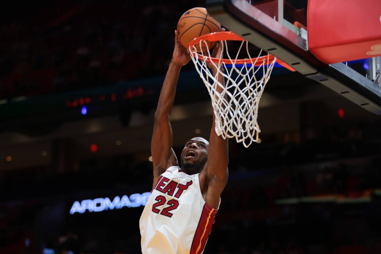 Oct 6, 2025; Miami, Florida, USA; Miami Heat forward Andrew Wiggins (22) dunks against the Milwaukee Bucks during the first quarter at Kaseya Center. Mandatory Credit: Sam Navarro-Imagn Images