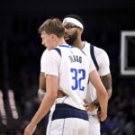 Oct 6, 2025; Fort Worth, Texas, USA; Dallas Mavericks forward/center Anthony Davis (3) talks with forward Cooper Flagg (32) during the second quarter at Dickie's Arena. Mandatory Credit: Jerome Miron-Imagn Images