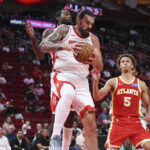 Oct 6, 2025; Houston, Texas, USA; Houston Rockets center Steven Adams (12) grabs a rebound during the third quarter against the Atlanta Hawks at Toyota Center. Mandatory Credit: Troy Taormina-Imagn Images