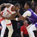 Oct 8, 2025; Houston, Texas, USA; Houston Rockets forward Kevin Durant (7) controls the ball as Utah Jazz forward Ace Bailey (19) defends during the second quarter at Toyota Center. Mandatory Credit: Troy Taormina-Imagn Images