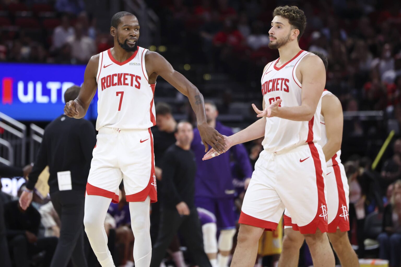 Houston Rockets forward Kevin Durant (7) talks with guard Reed Sheppard (15) after a play during the third quarter against the Utah Jazz at Toyota Center.