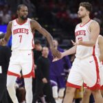 Oct 8, 2025; Houston, Texas, USA; Houston Rockets forward Kevin Durant (7) reacts with center Alperen Sengun (28) after a play during the third quarter against the Utah Jazz at Toyota Center. Mandatory Credit: Troy Taormina-Imagn Images