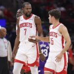 Oct 8, 2025; Houston, Texas, USA; Houston Rockets forward Kevin Durant (7) talks with guard Reed Sheppard (15) after a play during the third quarter against the Utah Jazz at Toyota Center. Mandatory Credit: Troy Taormina-Imagn Images
