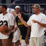 Oct 5, 2025; San Francisco, California, USA; Golden State Warriors guard De'Anthony Melton (8), guard Buddy Hield (7), and guard Seth Curry (31) cheer from the bench during a game against the Los Angeles Lakers in the fourth quarter at Chase Center. Mandatory Credit: David Gonzales-Imagn Images