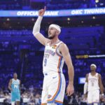Oklahoma City Thunder guard Alex Caruso (9) gestures after his team scores against the Charlotte Hornets during the second quarter of a game between the Charlotte Hornets and the Oklahoma City Thunder at Paycom Center.