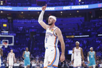 Oklahoma City Thunder guard Alex Caruso (9) gestures after his team scores against the Charlotte Hornets during the second quarter of a game between the Charlotte Hornets and the Oklahoma City Thunder at Paycom Center.