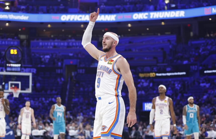 Oklahoma City Thunder guard Alex Caruso (9) gestures after his team scores against the Charlotte Hornets during the second quarter of a game between the Charlotte Hornets and the Oklahoma City Thunder at Paycom Center.