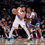 Oct 9, 2025; New York, New York, USA; New York Knicks center/forward Karl-Anthony Towns (32) looks for an opening as Minnesota Timberwolves center/forward Naz Reid (11) defends during the first half at Madison Square Garden. Mandatory Credit: John Jones-Imagn Images