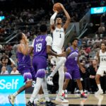 Oct 10, 2025; San Antonio, Texas, USA; San Antonio Spurs forward Victor Wembanyama (1) shoots over Utah Jazz forward forward Kyle Anderson (0) and guard Ace Bailey (19) during the first half at Frost Bank Center. Mandatory Credit: Scott Wachter-Imagn Images