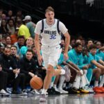 Oct 11, 2025; Dallas, Texas, USA; Dallas Mavericks forward Cooper Flagg (32) brings the ball up court against the Charlotte Hornets in the second half of a game at American Airlines Center. Mandatory Credit: Raymond Carlin III-Imagn Images