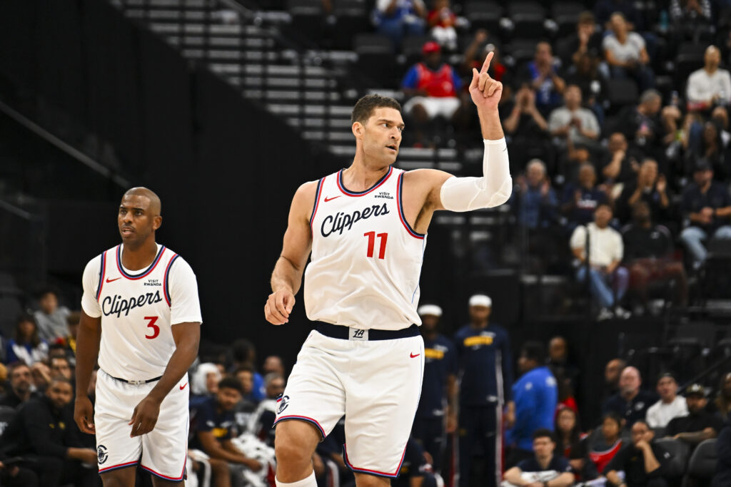 Oct 12, 2025; Inglewood, California, USA; Los Angeles Clippers center Brook Lopez (11) points with guard Chris Paul (3) against the Denver Nuggets during the first quarter at Intuit Dome. Mandatory Credit: Jonathan Hui-Imagn Images