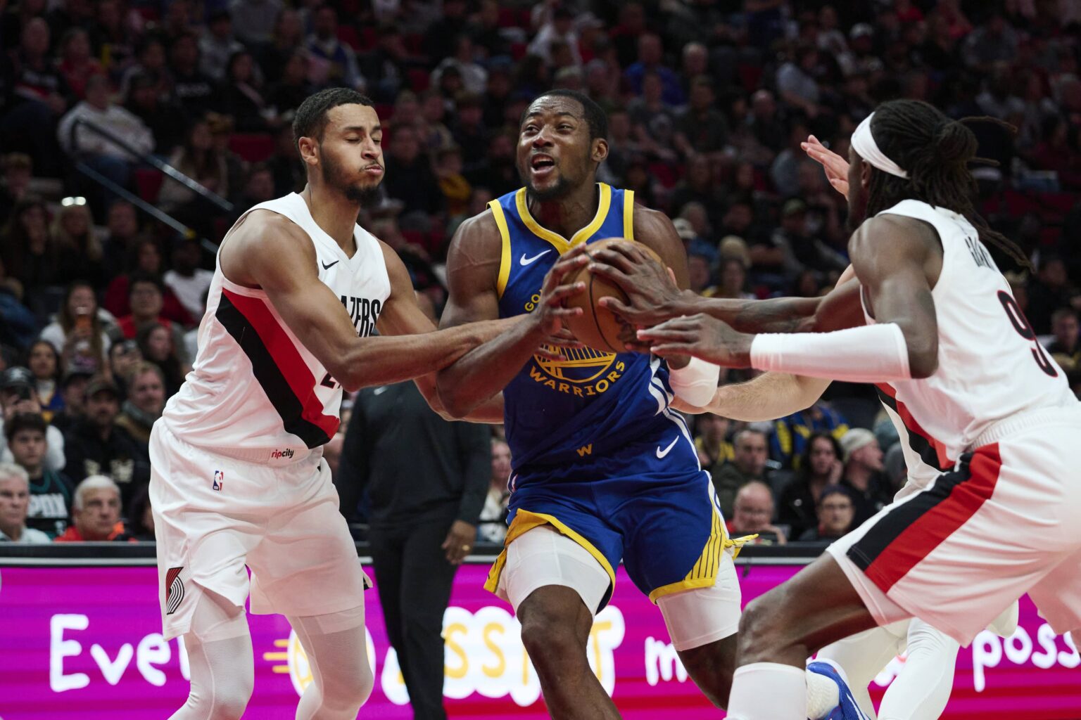 Oct 14, 2025; Portland, Oregon, USA; Golden State Warriors forward Jonathan Kuminga (1) drives to the basket during the first half against Portland Trail Blazers forward Kris Murray (24) at Moda Center. Mandatory Credit: Troy Wayrynen-Imagn Images