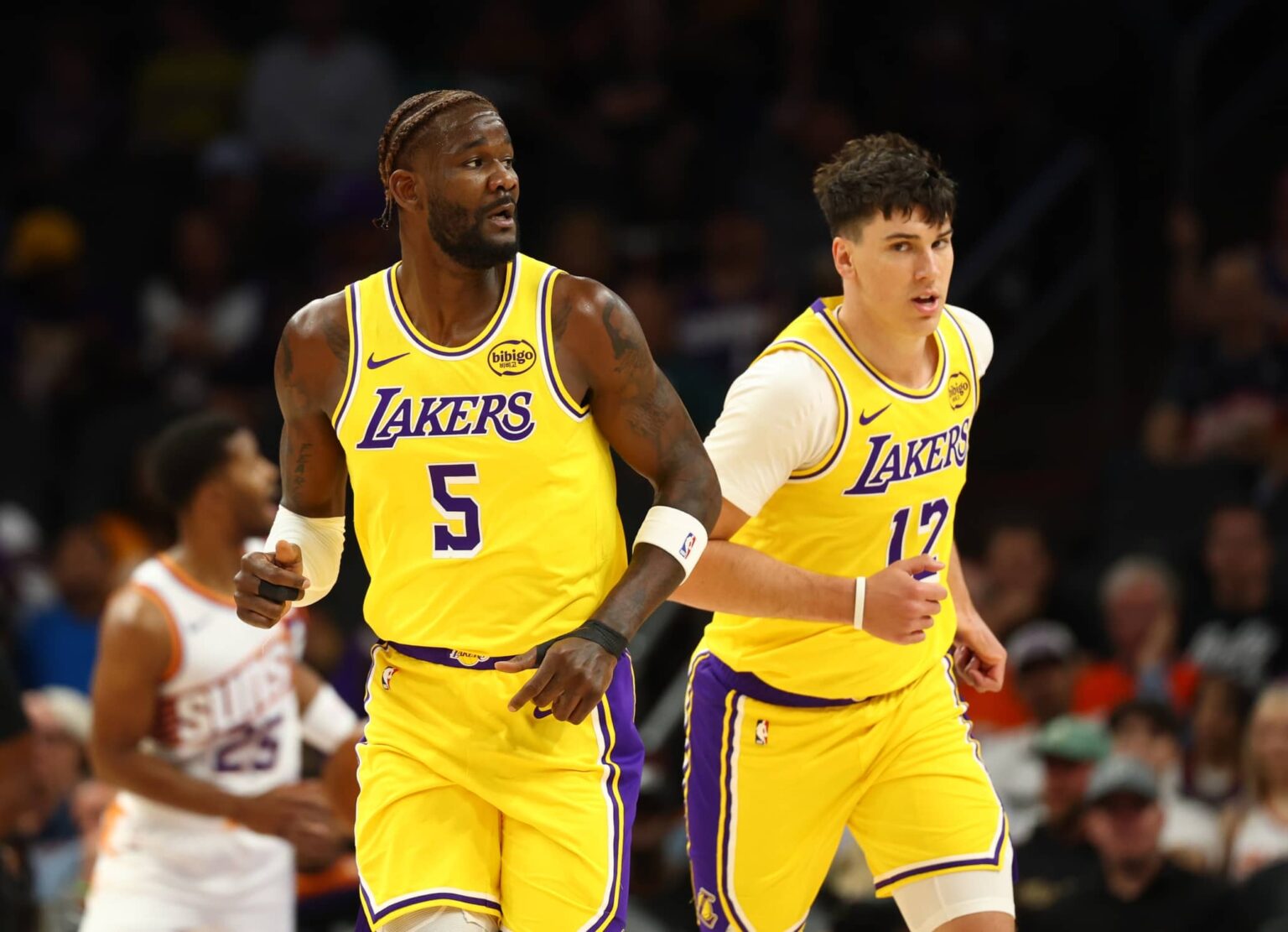 Oct 14, 2025; Phoenix, Arizona, USA; Los Angeles Lakers center Deandre Ayton (5) and forward Jake LaRavia (12) against the Phoenix Suns during an NBA preseason game at Mortgage Matchup Center. Mandatory Credit: Mark J. Rebilas-Imagn Images