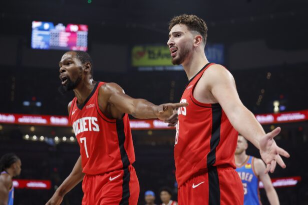 Oct 21, 2025; Oklahoma City, Oklahoma, USA; Houston Rockets forward Kevin Durant (7) and center Alperen Sengun (28) react after a play against the Oklahoma City Thunder during the first half at Paycom Center. Mandatory Credit: Alonzo Adams-Imagn Images