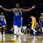 Oct 21, 2025; Los Angeles, California, USA; Golden State Warriors forward Draymond Green (23) reacts during the first half against the Los Angeles Lakers at Crypto.com Arena. Mandatory Credit: William Liang-Imagn Images