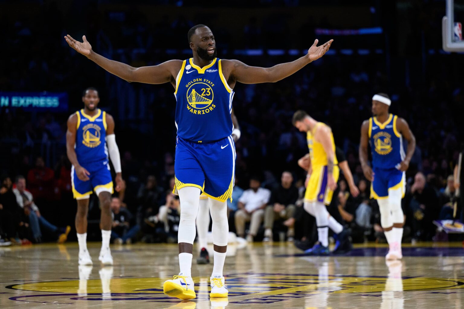 Oct 21, 2025; Los Angeles, California, USA; Golden State Warriors forward Draymond Green (23) reacts during the first half against the Los Angeles Lakers at Crypto.com Arena. Mandatory Credit: William Liang-Imagn Images