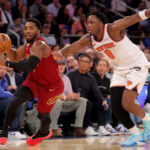 Oct 22, 2025; New York, New York, USA; Cleveland Cavaliers guard Donovan Mitchell (45) brings the ball up court against New York Knicks forward OG Anunoby (8) during the second quarter at Madison Square Garden. Mandatory Credit: Brad Penner-Imagn Images