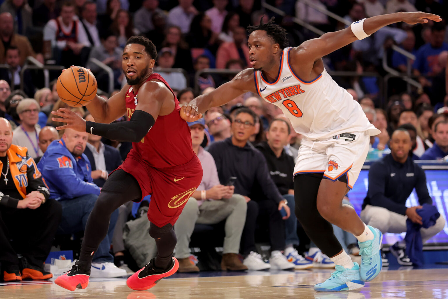 Oct 22, 2025; New York, New York, USA; Cleveland Cavaliers guard Donovan Mitchell (45) brings the ball up court against New York Knicks forward OG Anunoby (8) during the second quarter at Madison Square Garden. Mandatory Credit: Brad Penner-Imagn Images