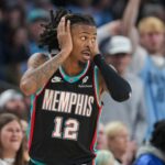 Grizzlies' Ja Morant (12) reacts after making a 3-pointer during the home opener against the New Orleans Pelicans at FedExForum on October 22, 2025.