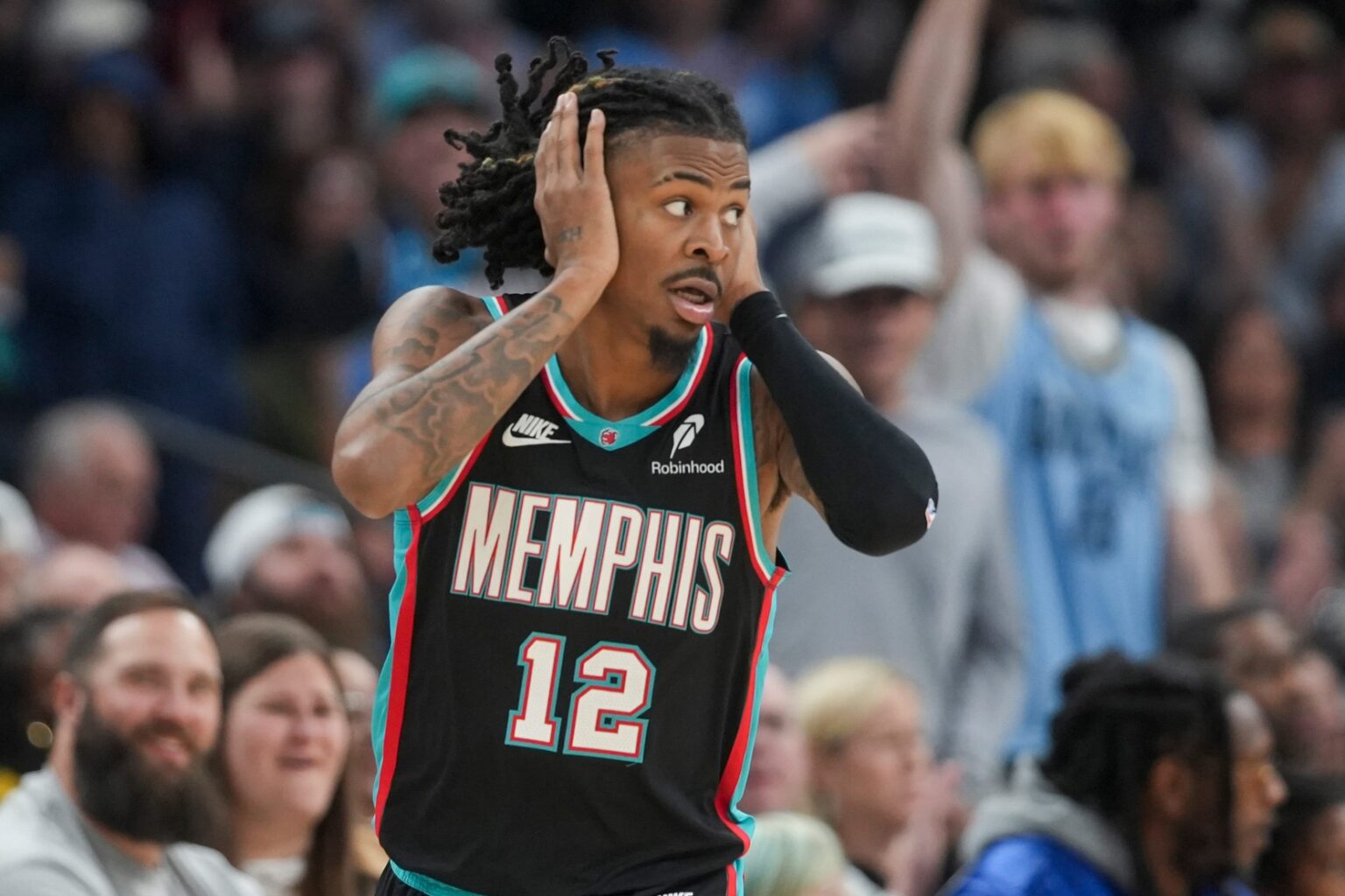 Grizzlies' Ja Morant (12) reacts after making a 3-pointer during the home opener against the New Orleans Pelicans at FedExForum on October 22, 2025.