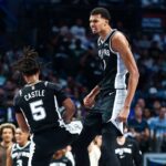 Oct 22, 2025; Dallas, Texas, USA; San Antonio Spurs forward Victor Wembanyama (1) celebrates with San Antonio Spurs guard Stephon Castle (5) during the first half against the Dallas Mavericks at American Airlines Center. Mandatory Credit: Kevin Jairaj-Imagn Images