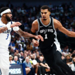 Oct 22, 2025; Dallas, Texas, USA; San Antonio Spurs forward Victor Wembanyama (1) drives to the basket as Dallas Mavericks forward Anthony Davis (3) defends during the second half at American Airlines Center. Mandatory Credit: Kevin Jairaj-Imagn Images