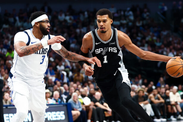 Oct 22, 2025; Dallas, Texas, USA; San Antonio Spurs forward Victor Wembanyama (1) drives to the basket as Dallas Mavericks forward Anthony Davis (3) defends during the second half at American Airlines Center. Mandatory Credit: Kevin Jairaj-Imagn Images