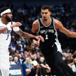 Oct 22, 2025; Dallas, Texas, USA; San Antonio Spurs forward Victor Wembanyama (1) drives to the basket as Dallas Mavericks forward Anthony Davis (3) defends during the second half at American Airlines Center. Mandatory Credit: Kevin Jairaj-Imagn Images